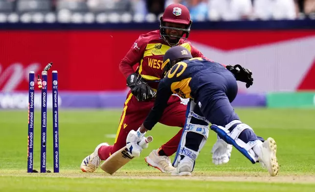 West Indies wicket keeper Shemaine Campbelle stumps out Sri Lanka's Sugandika Kumari during the ICC Women's T20 World Cup match between Sri Lanka and West Indies, in Manchester, England, Sunday, June 21, 2026. ( Jacob King/PA via AP)