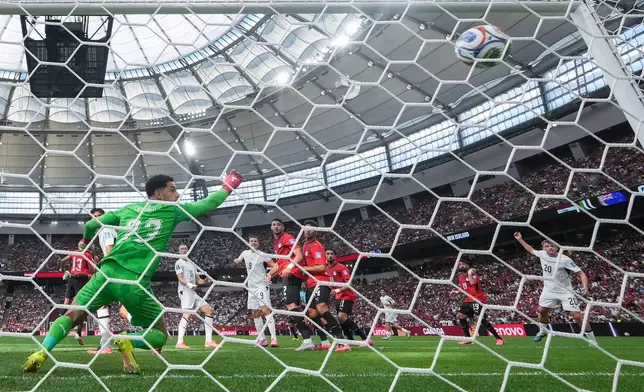 Egypt goalkeeper Mostafa Shoubir (23) allows a goal to New Zealand's Finn Surman (16) during the first half of the World Cup Group G soccer match in Vancouver, British Columbia, Sunday, June 21, 2026. (Darryl Dyck/The Canadian Press via AP)