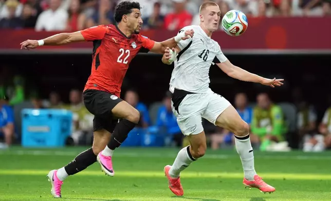 Egypt's Omar Marmoush (22) and New Zealand's Finn Surman (16) vie for the ball during the first half of a World Cup Group G soccer match in Vancouver, British Columbia, Sunday, June 21, 2026. (Ethan Cairns/The Canadian Press via AP)