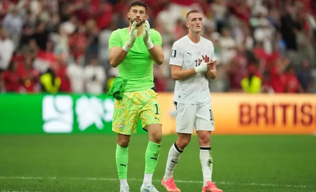 New Zealand goalkeeper Max Crocombe (1) reacts alongside Finn Surman (16) after losing the World Cup Group G soccer match between New Zealand and Egypt in Vancouver, British Columbia, Sunday, June 21, 2026. (AP Photo/Abbie Parr)