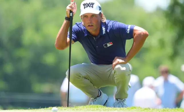 Eric Cole lines up a putt on the fifth green during the final round of the Charles Schwab Challenge golf tournament at Colonial Country Club in Fort Worth, Texas, Sunday, May 31, 2026. (AP Photo/LM Otero)