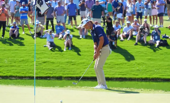 Eric Cole reacts to his putt on the 18th green during the final round of the Charles Schwab Challenge golf tournament at Colonial Country Club in Fort Worth, Texas, Sunday, May 31, 2026. (AP Photo/LM Otero)