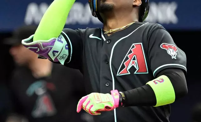 Arizona Diamondbacks' Geraldo Perdomo celebrates after his home run during the first inning of a baseball game against the Tampa Bay Rays, Friday, June 26, 2026, in St. Petersburg, Fla. (AP Photo/Jason Behnken)