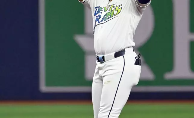 Tampa Bay Rays' Yandy Díaz celebrates his double during the sixth inning of a baseball game against the Arizona Diamondbacks, Friday, June 26, 2026, in St. Petersburg, Fla. (AP Photo/Jason Behnken)