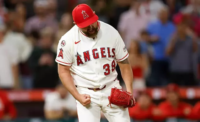 Los Angeles Angels relief pitcher Kirby Yates reacts after throwing out the last batter on the Athletics during the ninth inning of a baseball game Saturday, June 27, 2026, in Anaheim, Calif. (AP Photo/Caroline Brehman)