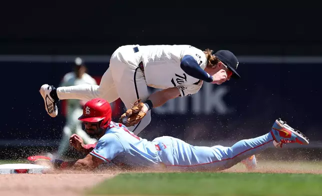 Minnesota Twins second baseman Luke Keaschall tags out St. Louis Cardinals' José Fermín on a steal attempt at second base during the sixth inning of a baseball game, Saturday, June 13, 2026, in Minneapolis. (AP Photo/Matt Krohn)
