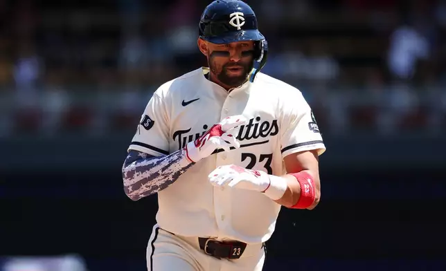 Minnesota Twins' Royce Lewis celebrates his solo home run as he runs the bases against the St. Louis Cardinals during the fourth inning of a baseball game, Saturday, June 13, 2026, in Minneapolis. (AP Photo/Matt Krohn)