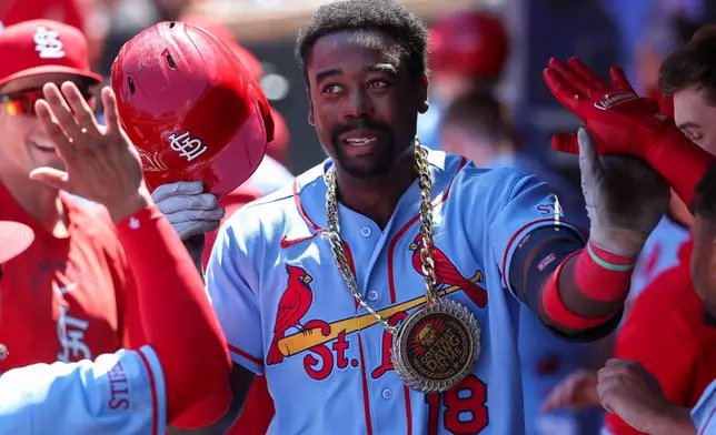 St. Louis Cardinals' Jordan Walker celebrates after hitting a solo home run against the Minnesota Twins during the seventh inning of a baseball game, Saturday, June 13, 2026, in Minneapolis. (AP Photo/Matt Krohn)