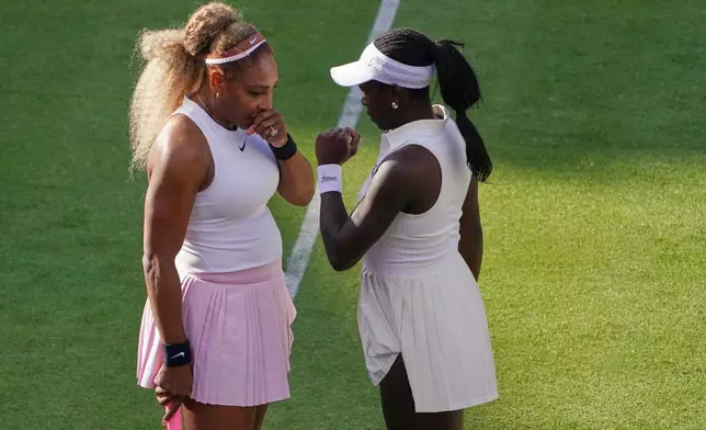 Serena Williams of the United States, left, talks to playing partner Victoria Mboko of Canada as they play against Nicole Melichar-Martinez of Canada and Erin Routliffe of New Zealand during their first round doubles match at the Queen's Club tennis championships in London, Tuesday, June 9, 2026. (AP Photo/Alberto Pezzali)