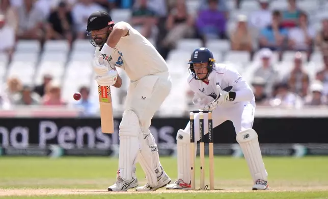 New Zealand's Daryl Mitchell bats, on day four of the Third Test cricket match between England and New Zealand, in Nottingham, England, Sunday June 28, 2026. (Joe Giddens/PA via AP)