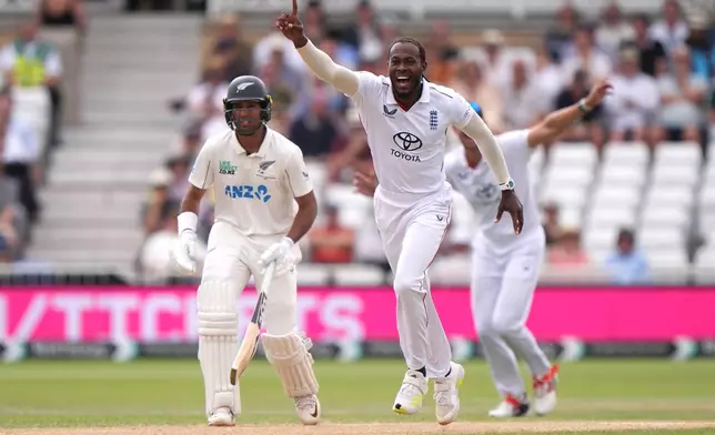 England's Jofra Archer celebrates the wicket of New Zealand's Daryl Mitchell before being overturned via a DRS review on day four of the Third Test cricket match between England and New Zealand, in Nottingham, England, Sunday June 28, 2026. (Joe Giddens/PA via AP)