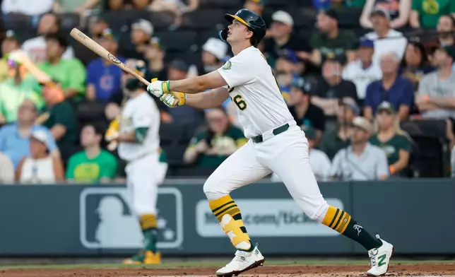 Athletics' Nick Kurtz (16) watches the ball as he hits a solo home run during the first inning of a baseball game against the Milwaukee Brewers, Tuesday, June 9, 2026, in Las Vegas. (AP Photo/Caroline Brehman)
