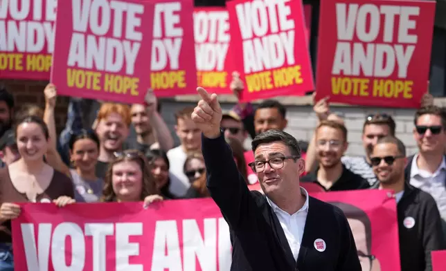 Andy Burnham, Britain's Labour candidate for Makerfield, gestures in front of supporters during the by-election in Makerfield, England, Thursday, June 18, 2026 where voters are choosing a new lawmaker with Andy Burnham of the Labour Party as the leading contender.(AP Photo/Jon Super)