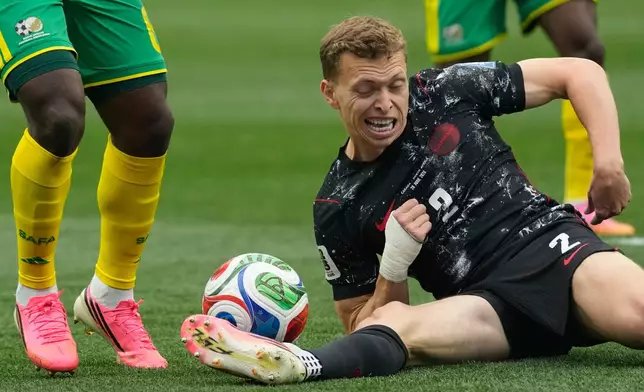Canada's Alistair Johnston kicks a ball during the World Cup round of 32 soccer match against South Africa in Inglewood, Calif., near Los Angeles, Sunday, June 28, 2026. (AP Photo/Andre Penner)
