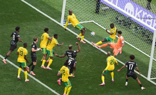 South Africa's Aubrey Modiba, (6), blocks a header by Canada's Moise Bombito during the World Cup round of 32 soccer match in Inglewood, Calif., near Los Angeles, Sunday, June 28, 2026. (AP Photo/Marcio Sanchez)