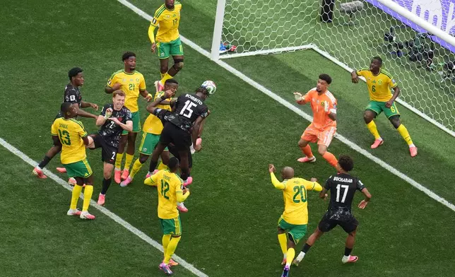 Canada's Moise Bombito, (15), makes an attempt to score against South Africa during the World Cup round of 32 soccer match in Inglewood, Calif., near Los Angeles, Sunday, June 28, 2026. (AP Photo/Marcio Sanchez)