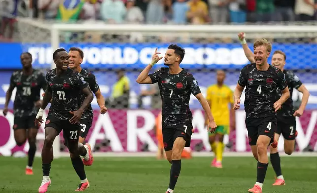 Canada's Stephen Eustaquio (7) celebrates scoring their opening goal against South Africa during the World Cup round of 32 soccer match in Inglewood, Calif., near Los Angeles, Sunday, June 28, 2026. (AP Photo/Andre Penner)