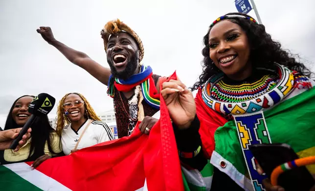 South Africa fans celebrate before a World Cup round of 32 soccer match between South Africa and Canada in Inglewood, Calif., near Los Angeles, Sunday, June 28, 2026. (AP Photo/Ethan Swope)