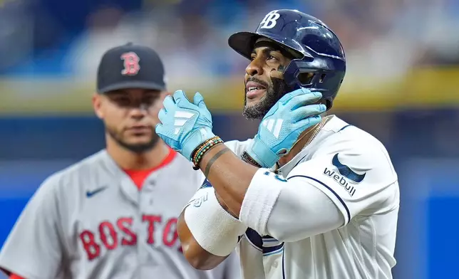Tampa Bay Rays' Yandy Díaz celebrates after hitting a single off Boston Red Sox pitcher Payton Tolle during the first inning of a baseball game Tuesday, June 9, 2026, in St. Petersburg, Fla. (AP Photo/Chris O'Meara)