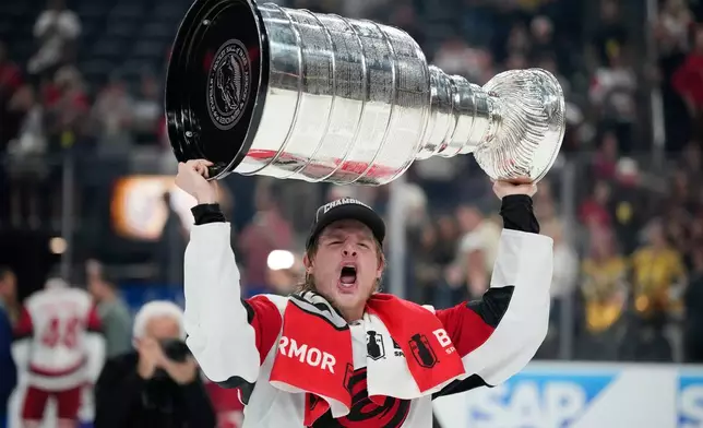 Carolina Hurricanes right wing Jackson Blake (53) celebrates after a win over the Vegas Golden Knights in Game 6 of the NHL hockey Stanley Cup Final series, Sunday, June 14, 2026, in Las Vegas. (AP Photo/John Locher)