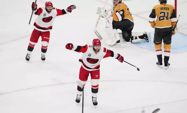 Carolina Hurricanes left wing Taylor Hall (71) celebrates after a goal by right wing Jackson Blake (53) during the second period in Game 6 of the NHL hockey Stanley Cup Final series against the Vegas Golden Knights, Sunday, June 14, 2026, in Las Vegas. (AP Photo/Candice Ward)