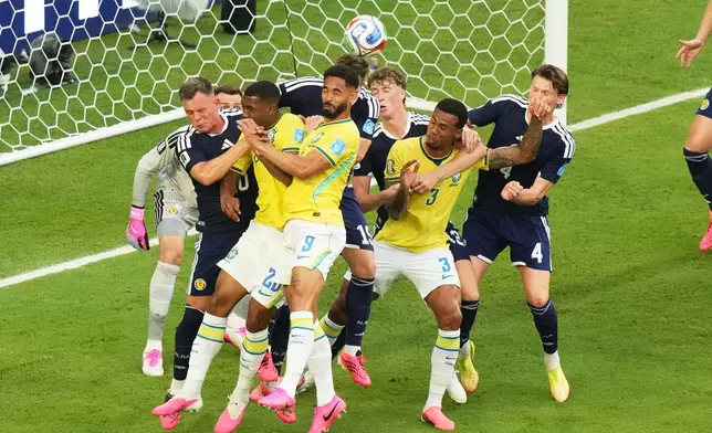 Brazil's Matheus Cunha (9) heads the ball during the World Cup Group C soccer match against Scotland in Miami Gardens, Fla., Wednesday, June 24, 2026. (AP Photo/Marta Lavandier)
