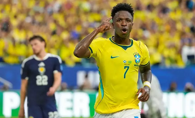Brazil's Vinicius Junior (7) celebrates after scoring his side's second goal during the World Cup Group C soccer match between Scotland and Brazil in Miami Gardens, Fla., Wednesday, June 24, 2026. (AP Photo/Rebecca Blackwell)