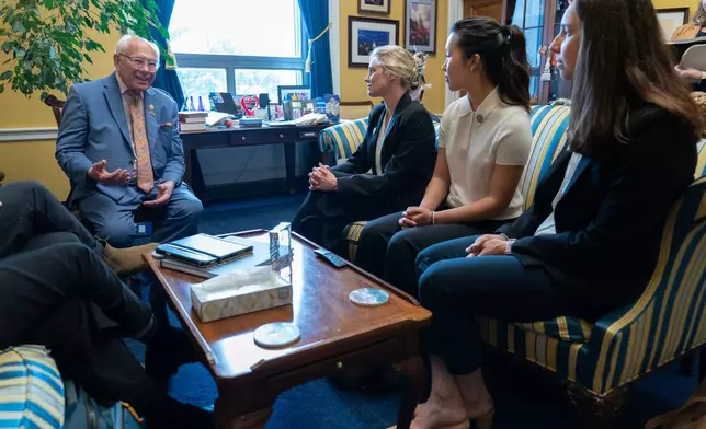 Rep. Paul Tonko, D-N.Y., speaks with Olympians Jessie Diggins, from center left, Bea Kim and Julia Kern, during a meeting to advocate for clean air, clean water and a healthy planet on Capitol Hill Tuesday, June 23, 2026, in Washington. (AP Photo/Jose Luis Magana)
