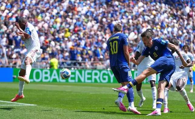 Bosnia's Ermin Mahmic (26) scores his side's third goal during the World Cup Group B soccer match between Bosnia and Qatar in Seattle Wednesday, June 24, 2026. (AP Photo/Manu Fernandez)