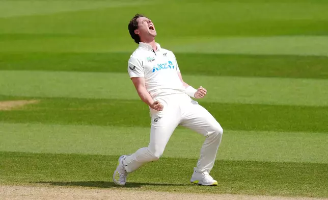 New Zealand's Matt Henry celebrates taking the wicket of England's Joe Root on day five of the Second Rothesay Test cricket match between England and New Zealand in London, England, Sunday, June 21, 2026. (Ben Whitley/PA via AP