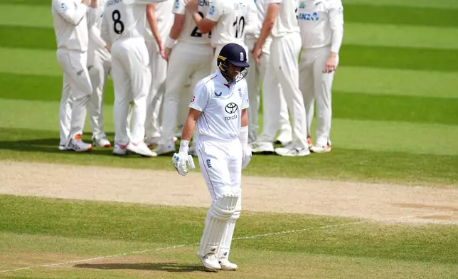 England's Joe Root reacts after being bowled out by New Zealand's Matt Henry on day five of the Second Rothesay Test cricket match between England and New Zealand in London, England, Sunday, June 21, 2026. (Ben Whitley/PA via AP