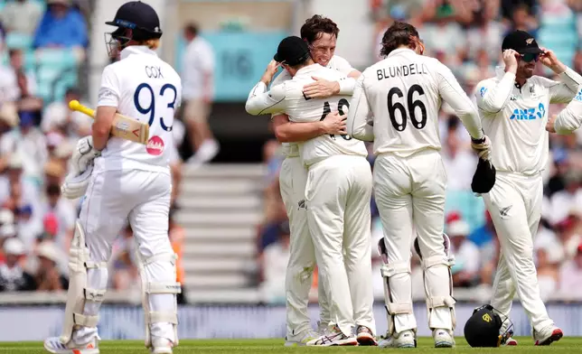 New Zealand's Matt Henry celebrates taking the wicket of England's Jordan Cox on day five of the Second Rothesay Test cricket match between England and New Zealand in London, England, Sunday, June 21, 2026. (Ben Whitley/PA via AP