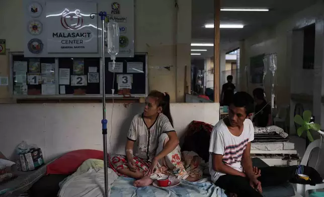 Evacuated residents take shelter at a hospital following an earthquake in General Santos, Philippines Tuesday, June 9, 2026. (AP Photo/Basilio Sepe)
