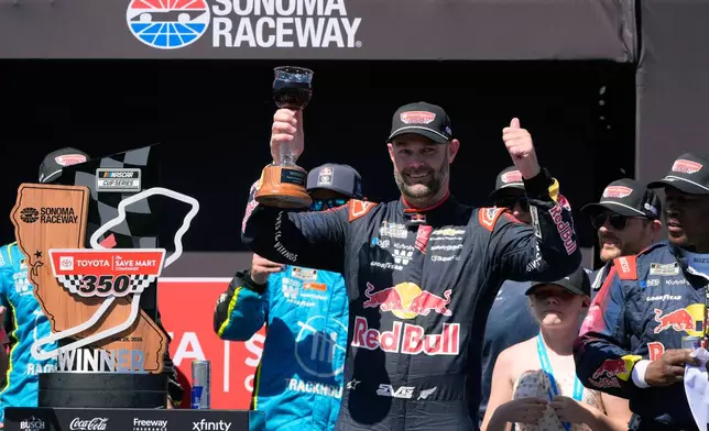 Shane van Gisbergen celebrates after winning a NASCAR Cup Series auto race at Sonoma Raceway, Sunday, June 28, 2026, in Sonoma, Calif. (AP Photo/Jeff Chiu)
