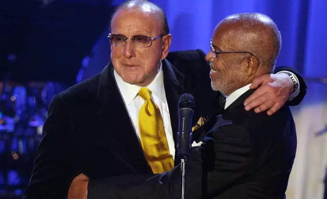 FILE - Music producer Berry Gordy, right, appears with Clive Davis during Davis' Pre-Grammy Party in Beverly Hills, Calif., on Feb. 10, 2007. (AP Photo/Danny Moloshok, File)