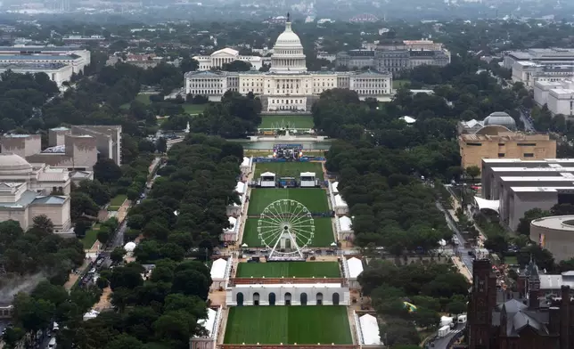 A Ferris wheel is seen on the National Mall for the 250 Anniversary celebration, Tuesday, June 23, 2026, in Washington. (AP Photo/Manuel Balce Ceneta)