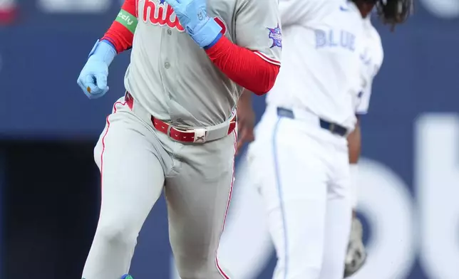 Philadelphia Phillies' Bryce Harper (3) rounds the bases after hitting a solo home run off Toronto Blue Jays pitcher Max Scherzer during the first inning of a baseball game in Toronto on Wednesday, June 10, 2026. (Chris Young/The Canadian Press via AP)