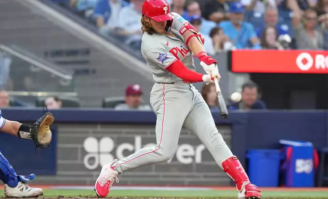 Philadelphia Phillies' Alec Bohm hits a three-run home run off Toronto Blue Jays pitcher Max Scherzer during the third inning of a baseball game in Toronto on Wednesday June 10, 2026. (Chris Young/The Canadian Press via AP)