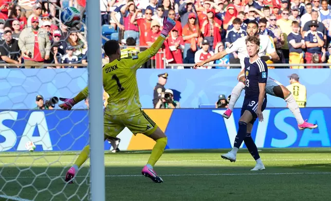 Morocco's Ismael Saibari, top right, scores his side's opening goal during the World Cup Group C soccer match between Scotland and Morocco in Foxborough, Mass., near Boston, Friday, June 19, 2026. (AP Photo/Martin Meissner)
