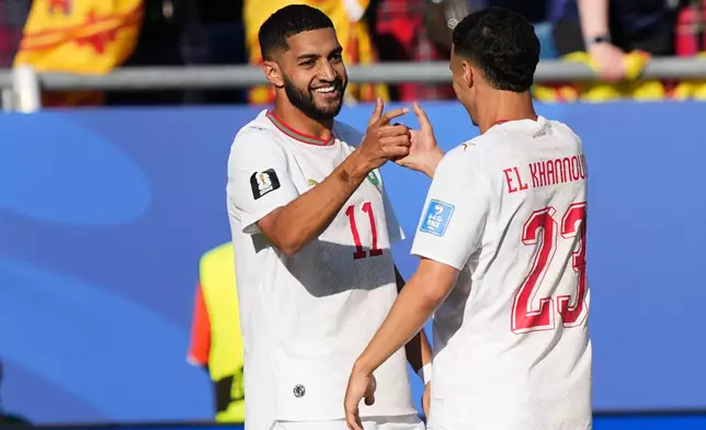 Morocco's Ismael Saibari, left, is congratulated after scoring his side's opening goal during the World Cup Group C soccer match between Scotland and Morocco in Foxborough, Mass., near Boston, Friday, June 19, 2026. (AP Photo/Martin Meissner)