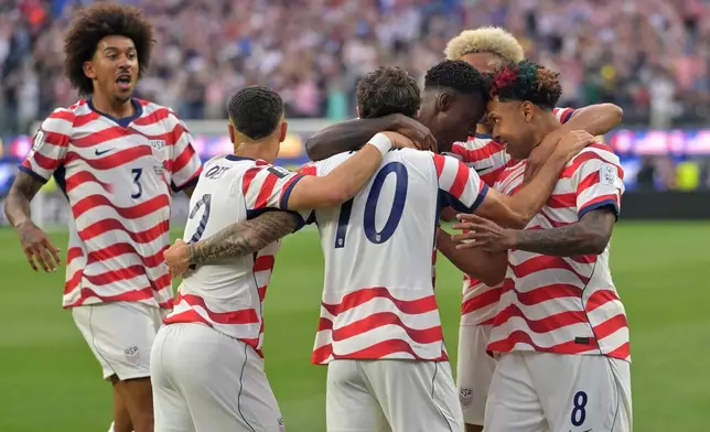 United States celebrates after an own goal by Paraguay's Damian Bobadilla during the World Cup Group D soccer match in Inglewood, Calif., near Los Angeles, Friday, June 12, 2026. (AP Photo/Jayne Kamin-Oncea)