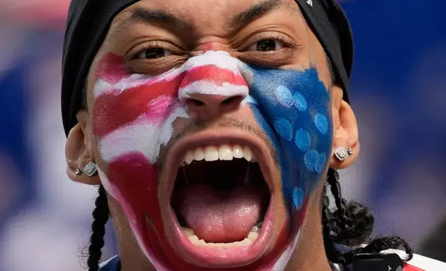 A United States fan cheers prior to the World Cup Group D soccer match between the United States and Paraguay in Inglewood, Calif., near Los Angeles, Friday, June 12, 2026. (AP Photo/Andre Penner)