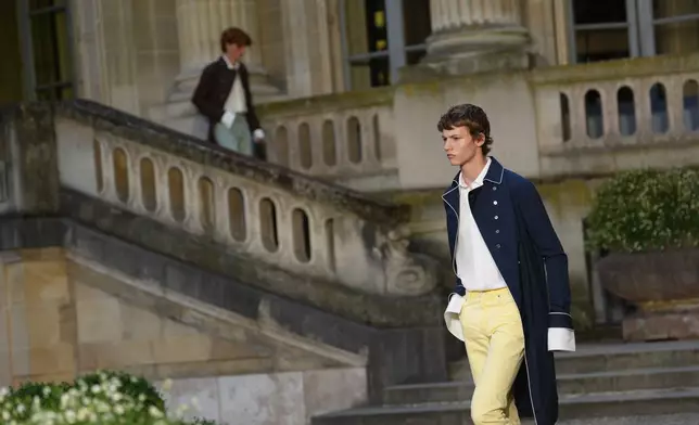Models wear creations as part of the Dior Homme Spring Summer 2027 collection presented in Paris, France, Wednesday, June 24, 2026. (AP Photo/Aurelien Morissard)