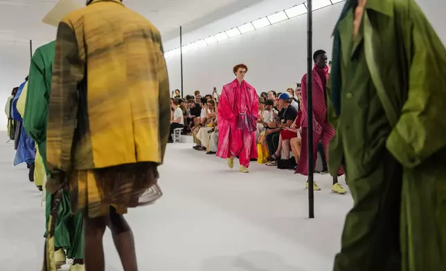 Models wear creations as part of the Issey Miyake Homme Spring Summer 2027 collection presented in Paris, France, Thursday, June 25, 2026. (AP Photo/Aurelien Morissard)