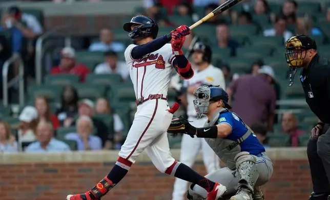 Atlanta Braves' Mauricio Dubón hits a three-run homer in the third inning of a baseball game against the Toronto Blue Jays, Wednesday, June 3, 2026, in Atlanta. (AP Photo/Mike Stewart)