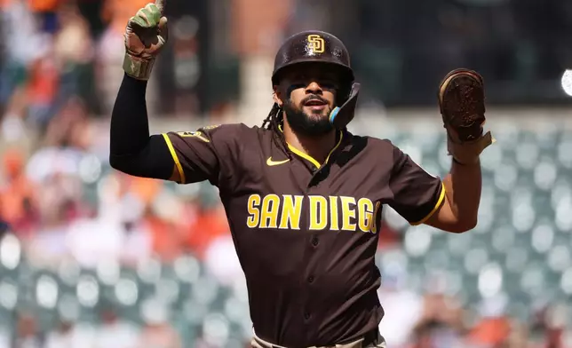 San Diego Padres' Fernando Tatis Jr. celebrates during the first inning of a baseball game against the Baltimore Orioles, Saturday, June 13, 2026, in Baltimore. (AP Photo/Daniel Kucin Jr.)
