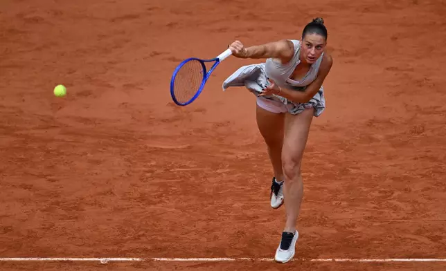 Ukraine's Marta Kostyuk serves to Russia's Mirra Andreeva during the semifinal tennis match at the French Open in Paris, Thursday, June 4, 2026. (AP Photo/Emma Da Silva)