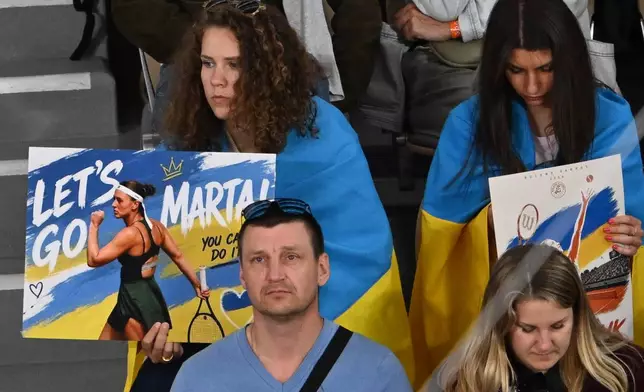 Fans supprtUkraine's Marta Kostyuk during the semifinal tennis match against Russia's Mirra Andreeva at the French Open in Paris, Thursday, June 4, 2026. (AP Photo/Emma Da Silva)