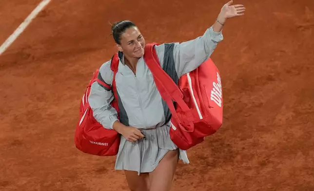 Ukraine's Marta Kostyuk walks off the court after the semifinal tennis match against Russia's Mirra Andreeva at the French Open in Paris, Thursday, June 4, 2026. (AP Photo/Christophe Ena)