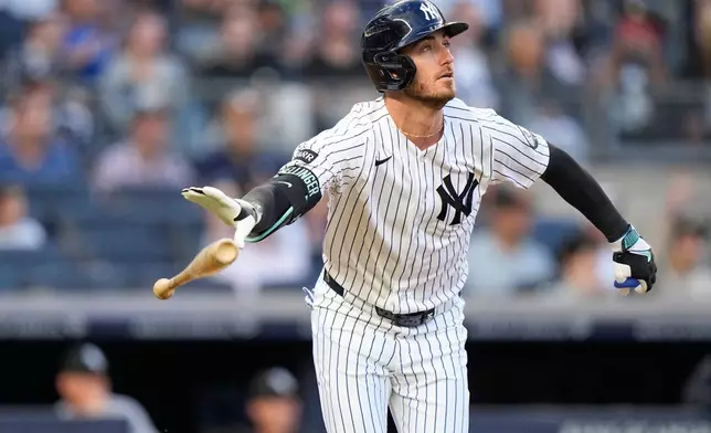 New York Yankees' Cody Bellinger (35) tosses his bat as he watches the ball he hit for a two-run home run during the first inning of a baseball game against the Chicago White Sox Wednesday, June 17, 2026, in New York. (AP Photo/Frank Franklin II)